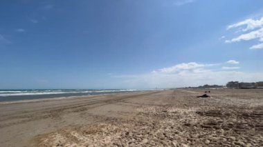 romagnola beach rimini in spring with sun and strong wind. High quality 4k footage