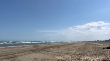 romagnola beach rimini in spring with sun and strong wind. High quality 4k footage