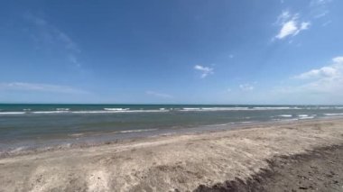 romagnola beach rimini in spring with sun and strong wind. High quality 4k footage