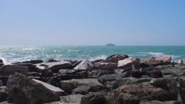 rocks and rough Ligurian sea in Italy Boccadasse. High quality 4k footage