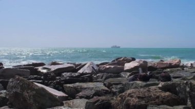 rocks and rough Ligurian sea in Italy Boccadasse. High quality 4k footage