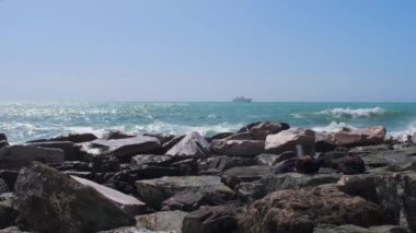 rocks and rough Ligurian sea in Italy Boccadasse. High quality 4k footage