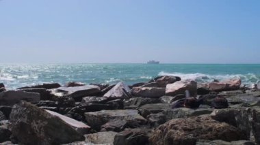 rocks and rough Ligurian sea in Italy Boccadasse. High quality 4k footage