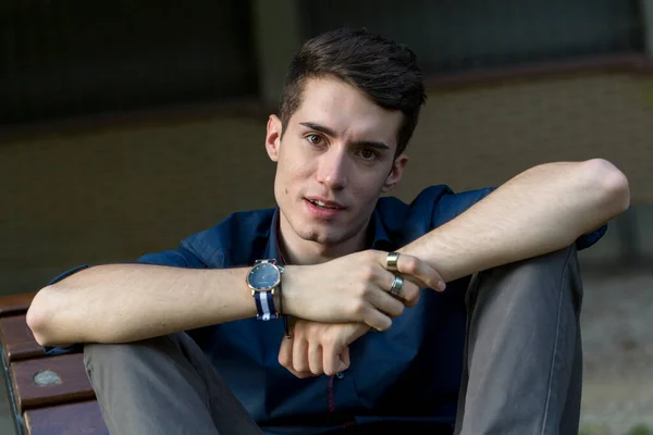 Beautiful Dark Haired Boy Cross Legged Bench High Quality Photo — Stok fotoğraf