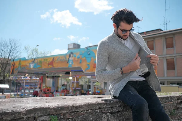 Handsome Italian Dark Haired Guy Jacket Sitting Low Wall Sunny — Fotografia de Stock