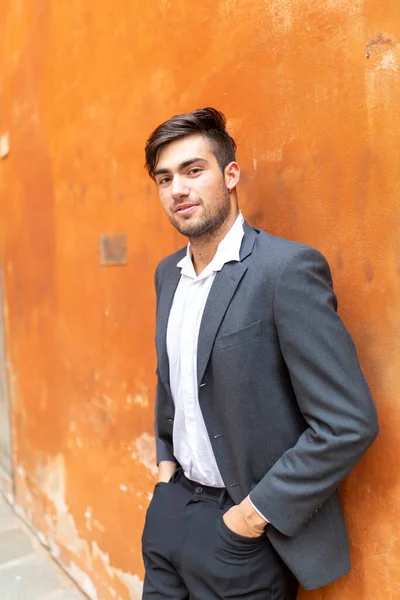 Handsome Italian Dark Haired Guy Shirt Black Jacket Red Wall Royalty Free Stock Images