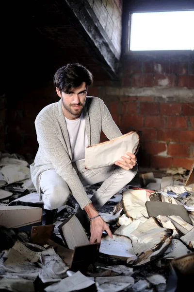 Beautiful Italian Dark Haired Boy Collects Old Burnt Documents High — Stok fotoğraf