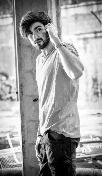 Handsome Dark Haired Italian Guy Decadent Abandoned Factory Uses Phone — Stockfoto