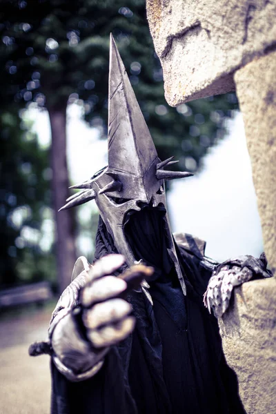 Nazgul warrior with helmet and sword from the lord of the rings. High quality photo