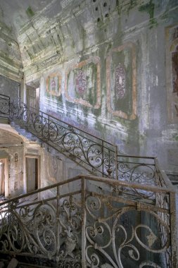 staircase with metal railing in old abandoned house. High quality photo