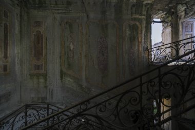staircase with metal railing in old abandoned house. High quality photo
