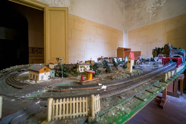 recreation room with toy train in abandoned school orphanage. High quality photo