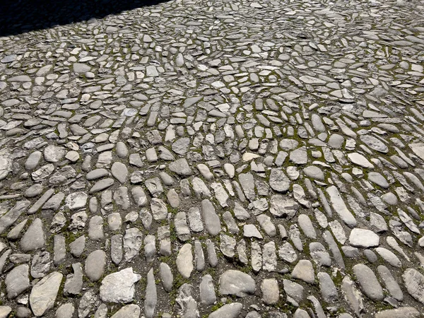 medieval road pavement with river stones. High quality photo
