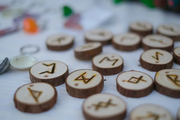 pieces of wood with runic symbols in the flea market. High quality photo
