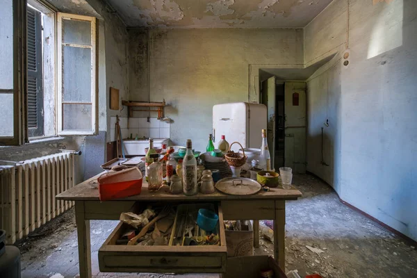 kitchen with furniture and table in abandoned house. High quality photo