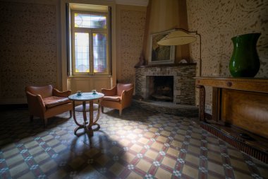 large living room with old furniture in old abandoned mansion. High quality photo