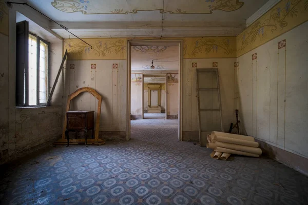 large living room with furniture and shelves in large abandoned house. High quality photo