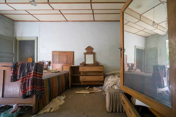 large living room with furniture and shelves in large abandoned house. High quality photo