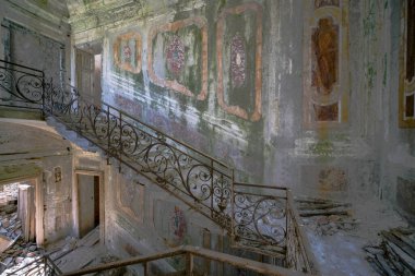 staircase with metal railing in old abandoned house. High quality photo
