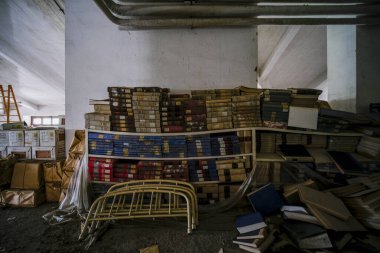 library with old books and magazines in large abandoned house. High quality photo