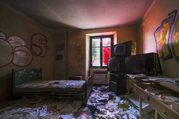 bedroom with bed and wardrobe in old abandoned house. High quality photo