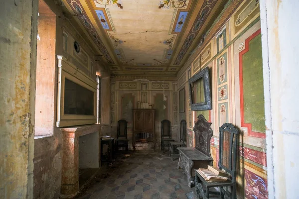 living room with fireplace in old abandoned house. High quality photo