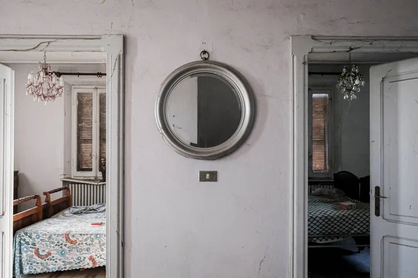 fattening and wall with round mirror in abandoned house. High quality photo
