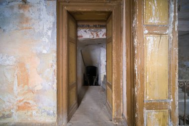 interior stage and armchairs of old decadent abandoned theater in Italy. High quality photo