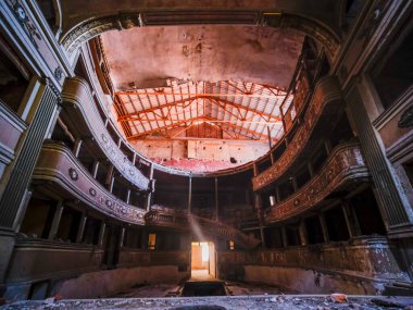 interior stage and armchairs of old decadent abandoned theater in Italy. High quality photo