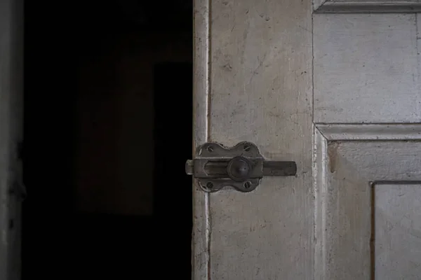 handle and lock with key in abandoned house. High quality photo