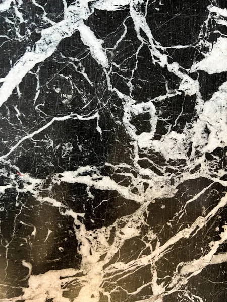 black marble background with white veins. High quality photo