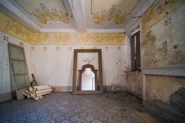 fireplace and mirror room in large abandoned house. High quality photo