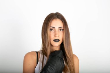 beautiful brunette italian girl with white top and black lipstick. High quality photo