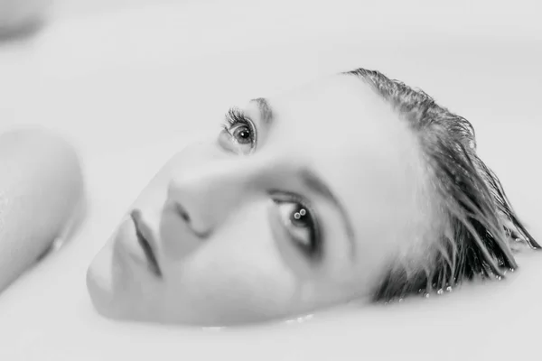 black and white girl portrait in white water. High quality photo