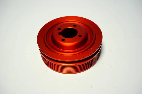 flange for petrol engine in red ergal. High quality photo