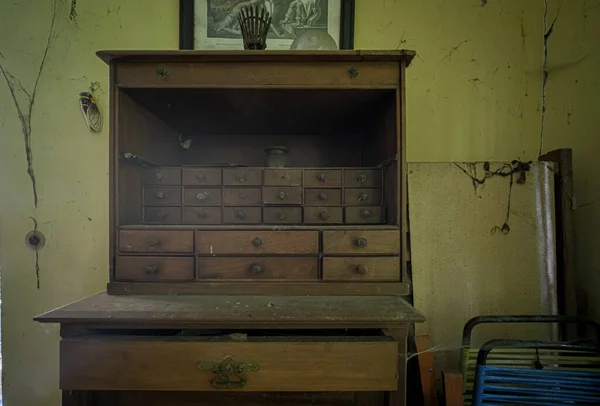 wooden writing desk in old large abandoned luxurious house. High quality photo