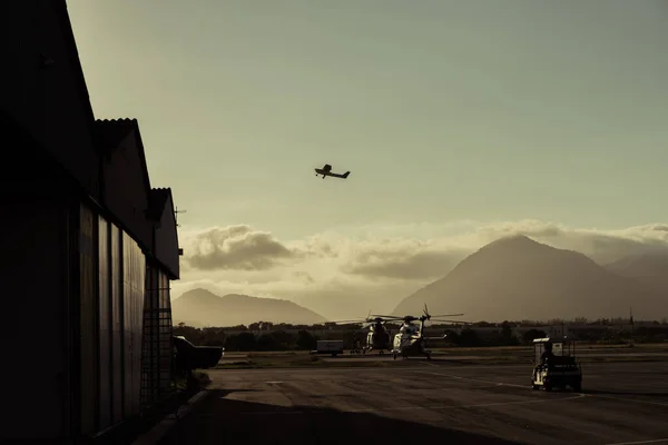 The plane leaves the hangar far away in the tropics.