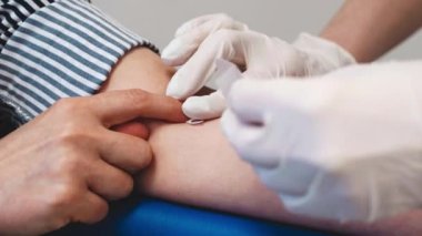 Sticking the patch after passing a blood test.