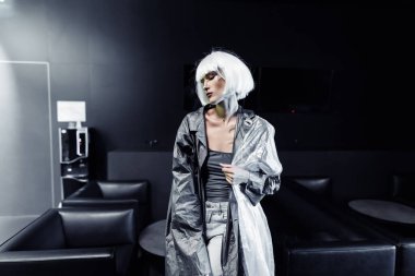 Fashionable blonde in a raincoat. High quality photo