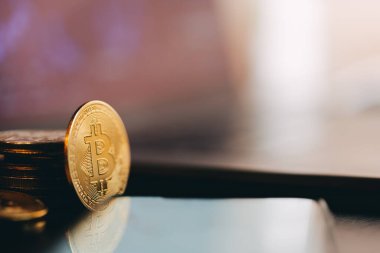 Cryptocoins near laptop with chart. High quality photo