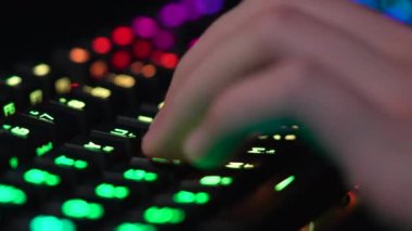 Clicking on a neon keyboard. High quality 4k footage