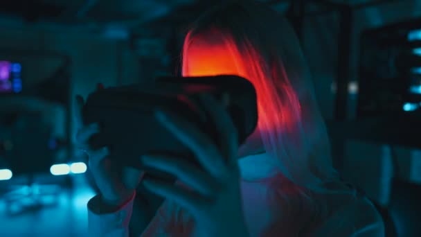 Woman Puts Virtual Reality Glasses Neon Room Cyber Space High — стоковое видео