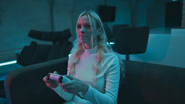 Young Woman Plays Console Room Neon Lights High Quality Footage — Stock Video