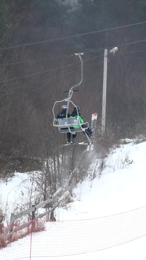 People on chairlift at ski resort — Stock Video