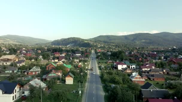 Aerial view of carpathian village in ukrainian mountains — стокове відео