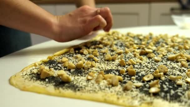 Woman making buns with poppy seeds and nuts — Video Stock