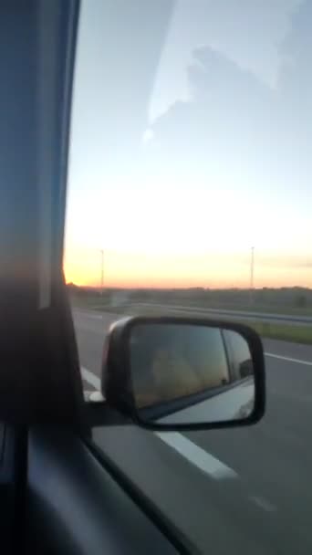 Woman reflection in rear mirror car travel — Vídeo de Stock
