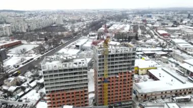 apartment building construction site aerial view winter season