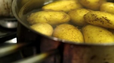 washing potatoes in the sink close up