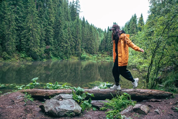 Woman Hiker Backpack Yellow Raincoat Looking Mountain Lake Copy Space — Stock Photo, Image